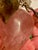 This is a lovely bright pink piece of rose quartz carved into the shape of a plum with hard stone leaves attached by satin...
