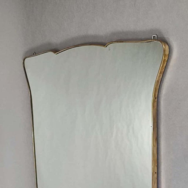 Large, full-length wall mirror in the style of Gio Ponti. An elegant example of classic Italian design from the 1950s....