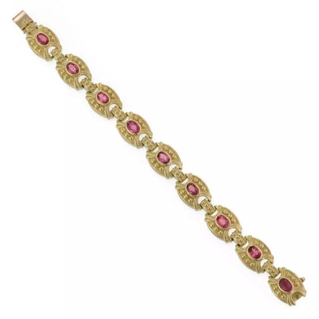 This lovely authentic bracelet is by Judith Ripka, it is crafted from 18k yellow gold featuring a fancy shape oval link...