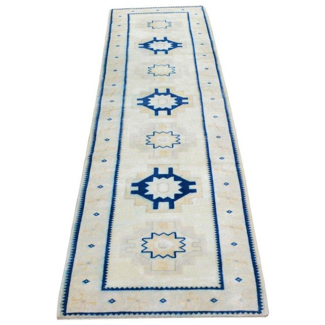 Hand-knotted with care using traditional rug-making techniques, this wool rug blends timeless craftsmanship with a modern...