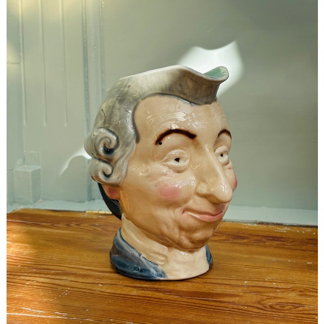 This original Toby jug is an example of classic French majolica from the late 19th century. The jug is shaped as a judge...