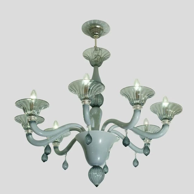 Hand blown pale grey colour glass. Made in Murano Italy. This piece is designed in the style of the selected designer...