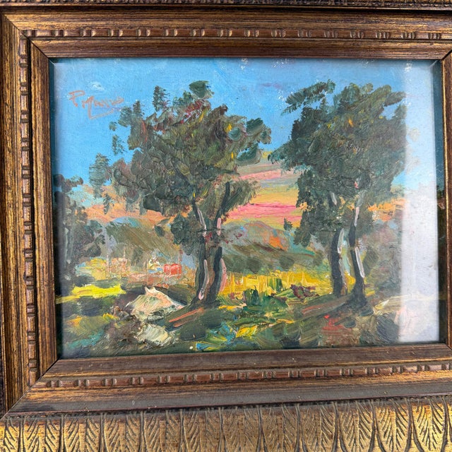Antique Italian oil on canvas landscape painting depicting a sunlit countryside scene with trees and rolling fields....