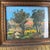 Antique Italian oil on canvas landscape painting depicting a sunlit countryside scene with trees and rolling fields....