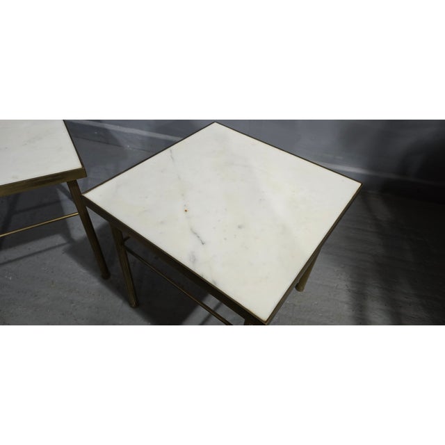 A very good pair of French heavy brass and white marble topped end or lamp tables with reeded legs, in overall very good...