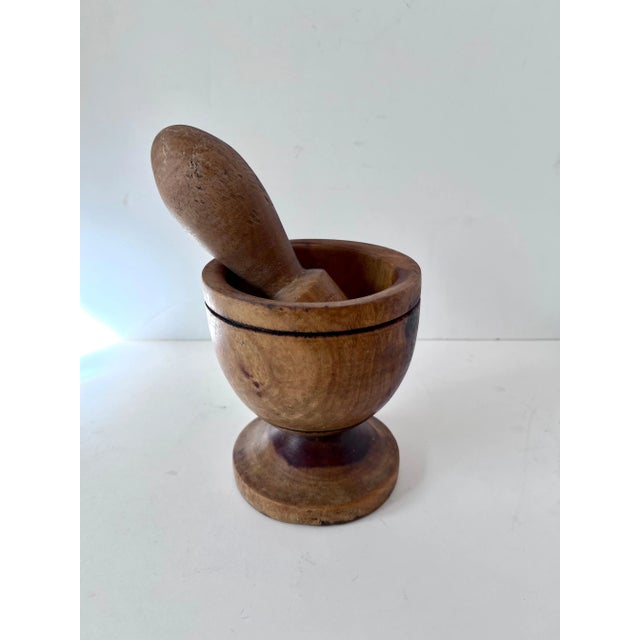 A well crafted wooden Folk Art Mortar and Pestle. The piece is used for crushing everything from herbs and spices, to...