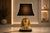 A bold and highly decorative vintage table lamp in the Egyptian Revival style, featuring a sculptural brass pharaoh bust...
