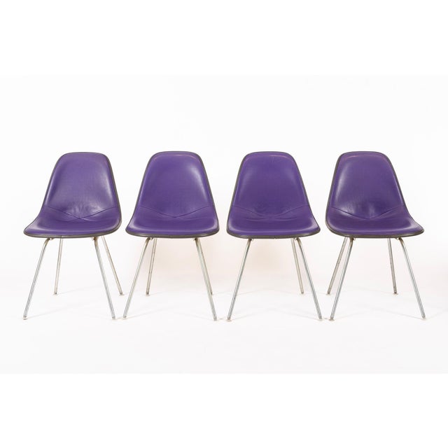 These vintage mid century modern purple DSX side chairs designed by Charles and Ray Eames for Herman Miller were produced...