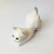 A vintage ceramic cat sculpture finished in a glossy white glaze with blue eyes. Made in Portugal by Elpa Alcobaca, marked...