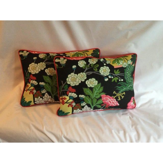 These elegant shumaker black pillows with a red trim and floral design will be perfect for any living space(inserts included)