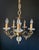 A magnificent antique chandelier. france, 20th century. the chandelier is made of brass and bronze. It’s adorned with...
