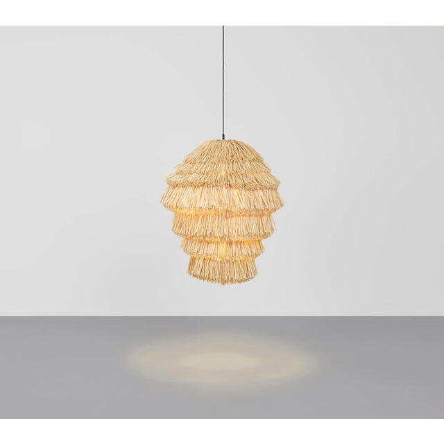 Fran as lamp by llot llov handcrafted light object dimensions: ø 65 cm x h: 90 cm materials: raffia fringes colour: beige...