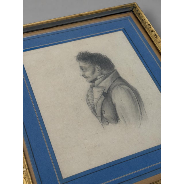 This intimate profile portrait drawn in graphite depicts a distinguished gentleman facing left, his features modeled with...