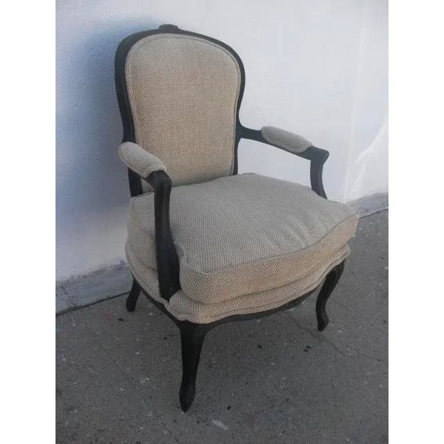 Oooo la la! We are loving this revamped Louis XV style armchair with a matte black painted wood frame and intact caned...