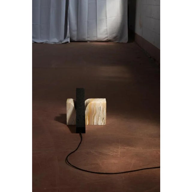 Viscoelastic stone vertical small lamp by mut design dimensions: d 35 x w 5 x h 15 cm. Materials: : onyx, volcanic stone...