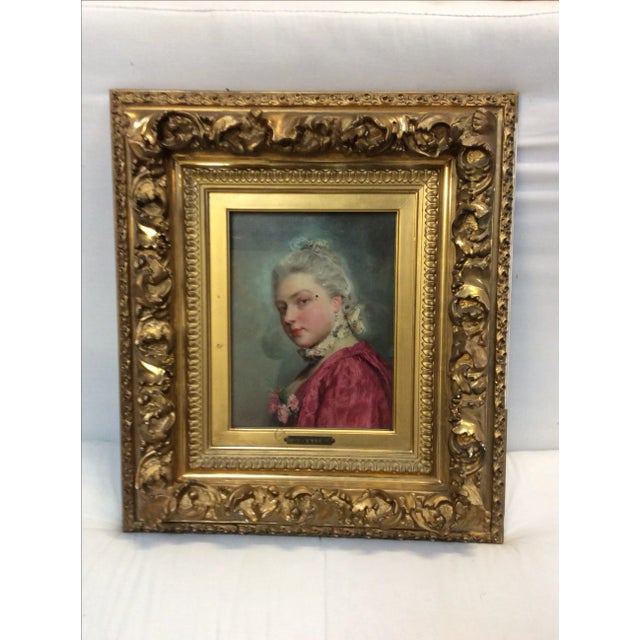 Beautiful portrait of a lady with flowers on her pink dress. This is under glass and in it's original frame and was...