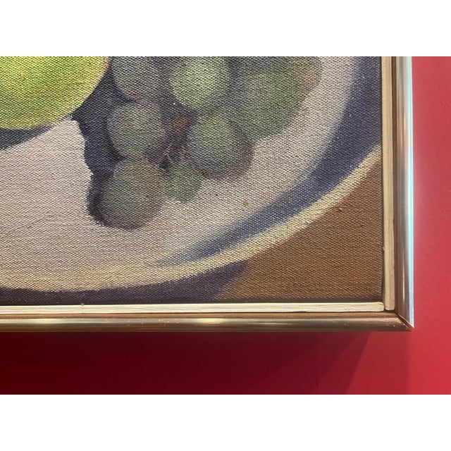 Wonderfully composed still life of grapes and a green apple on a white plate. Signed and dated 1964 on the verso bey...
