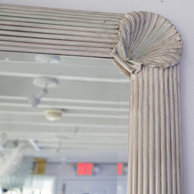 Vintage circa 1980s pencil reed bamboo with shell corner motif. Beveled glass mirror framed with unique frame. Frame is...