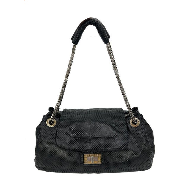 Chanel Perforated Drill Flap Accordion Classic In very good condition. Soft black perforated leather body trimmed with...