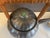 Elegant mid‑century Asian pewter teapot featuring a ribbed melon‑form body, rattan‑wrapped square handle, and jade‑style...