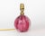 A scarce pair of small, but weighty, ribbed globe-shaped sommerso glass table lamps, with a core of pink, a layer of...