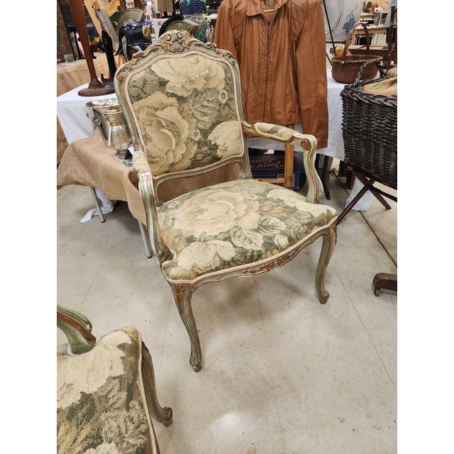 Pretty pair of French Style open arm chairs with painted and partial giltwood finish.