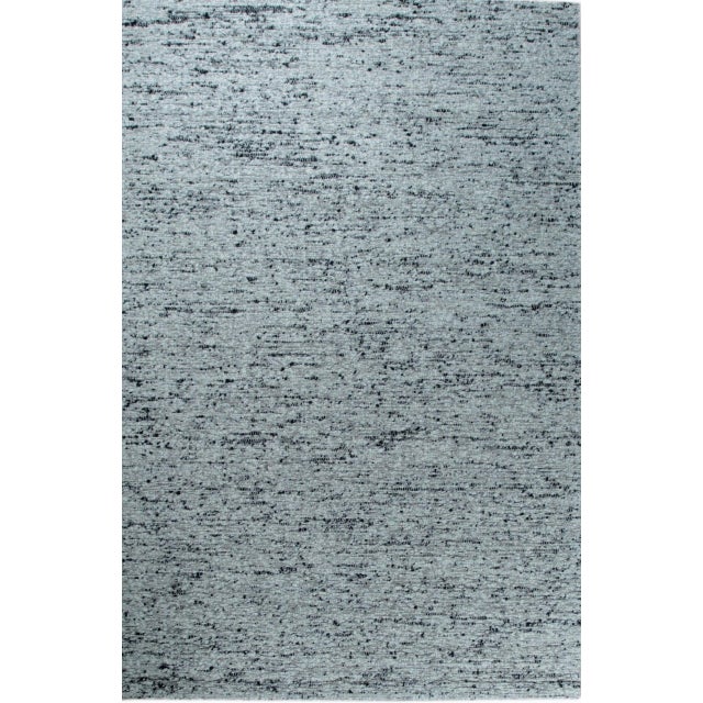 Opulent Alluring Dark Gray Handmade Wool Rug, Country of Origin: India. This luxurious hand-knotted wool piece offers a...