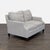 This Lexington loveseat features a clean, modern design with soft light gray fabric. The cushioned seats and backs provide...