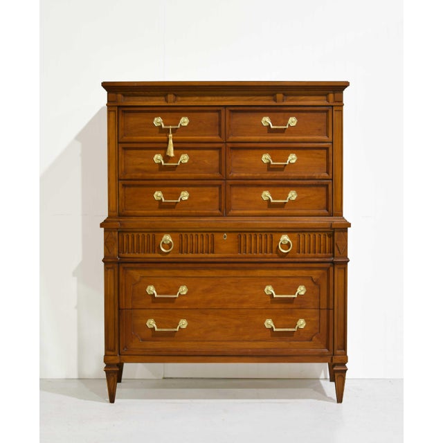 This expertly crafted Mid Century Transitional Highboy Dresser by Thomasville is a beautiful addition to any room....