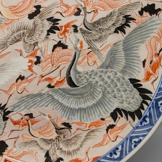 Beautiful birds in flight. Japanese export porcelain charger, c. 1850. The central scene is of numerous red-crowned...