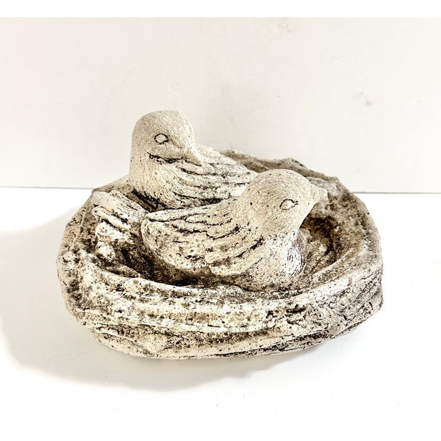 Two resting birds nestle together within a rustic twig nest in this charming vintage concrete garden sculpture. Richly...