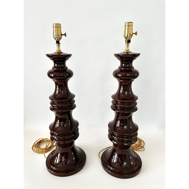 Pair of vintage modern style ceramic lamps in rich brown glossy glaze. Newly wired with brass fittings and on/off sockets....