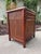 A charming vintage burnt bamboo and cane accent cabinet with a warm, inviting patina and plenty of texture. Features a...