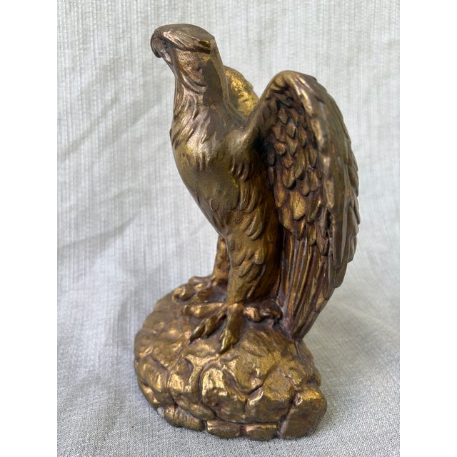 Elegant, heavy, vintage solid bronze eagle figurine. Standing on rocks with his beautiful wings spread. Can also be used...
