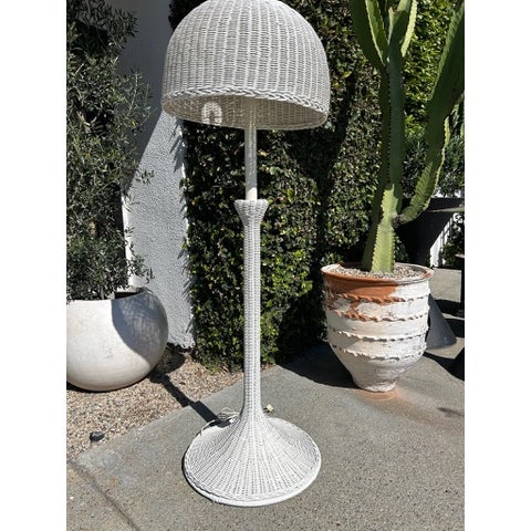 Vintage floor lamp with woven wicker construction in a white finish. Features a dome-shaped shade with open weave pattern,...