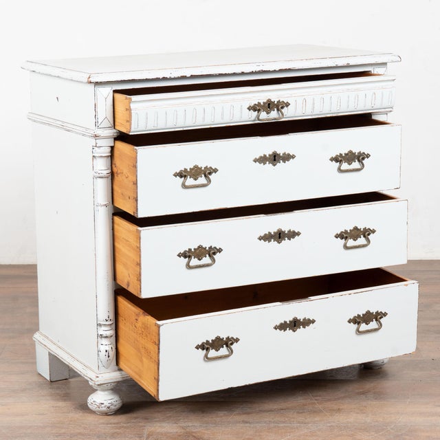 Antique pine chest of four drawers, with traditional fluted carving along the top narrow top drawer. Half column details...
