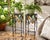 Whimsical vintage pair of Mid-Century wrought iron plant stands or decorative pedestals, circa 1960s–1970s. The slender...