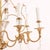 This Vintage French Bagues Manner Gilt Iron and Crystal Chandelier is a luxurious and elegant lighting fixture. The...