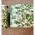 Custom-made ottoman upholstered in an elegant green botanical toile fabric featuring lush tropical motifs and refined...