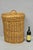 Vintage Mid Century Modern Handwoven Wicker Rattan Laundry Basket with Lid and Handle. Circa Late 20th Century....