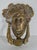 A distinctive Victorian cast brass door knocker dating to circa 1900, modelled as the head of Dionysus crowned with an ivy...