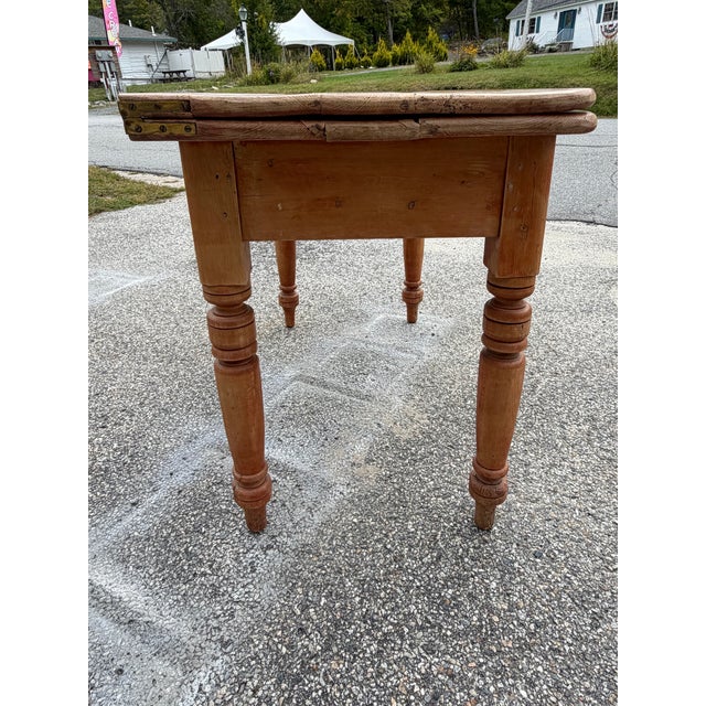 Up for sale in Sunapee Harbor is an Antique Scrubbed Pine Drop-leaf Table. This table came from a local estate here in New...