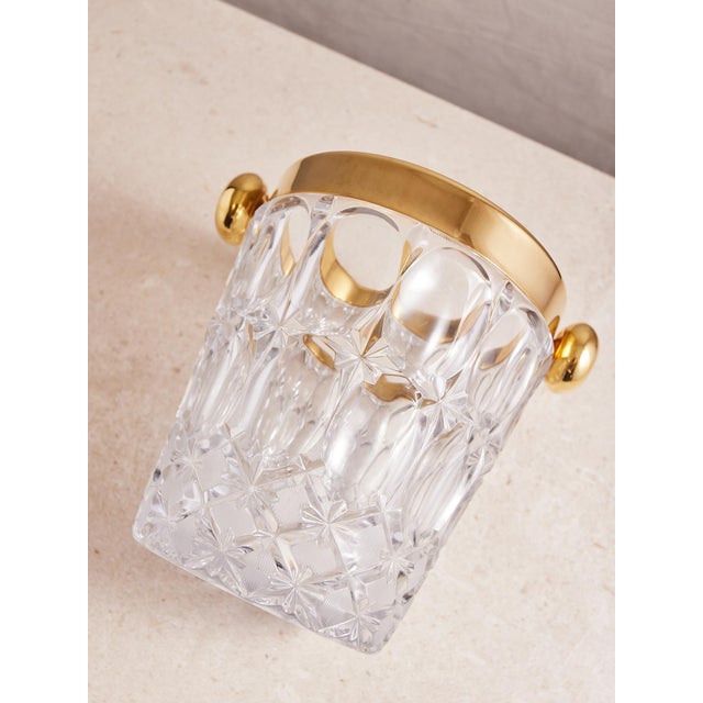 This stunning cut crystal and gold plated ice bucket is an absolutely stunning addition to your bar cart or bar cabinet....