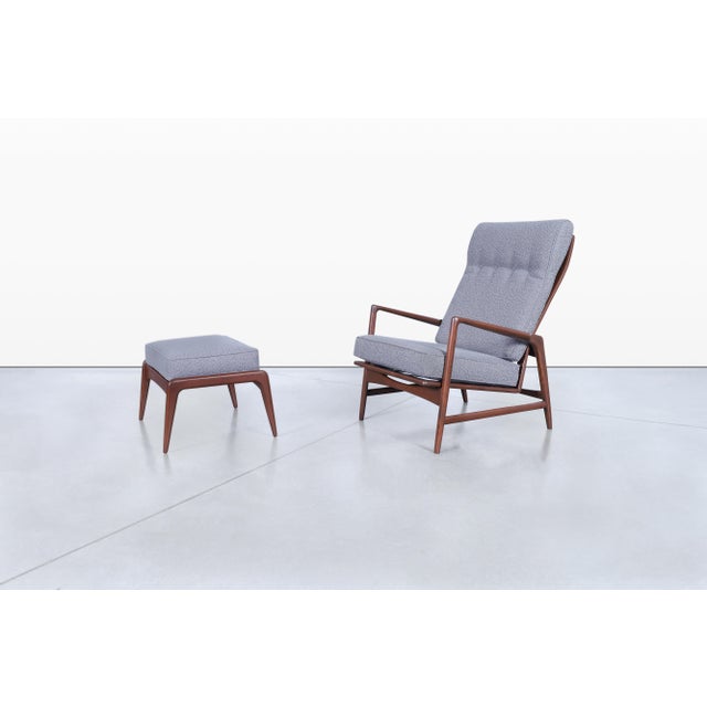 Ib Kofod Larsen expertly crafted this remarkable Danish modern walnut reclining lounge chair and ottoman in the 1950s....
