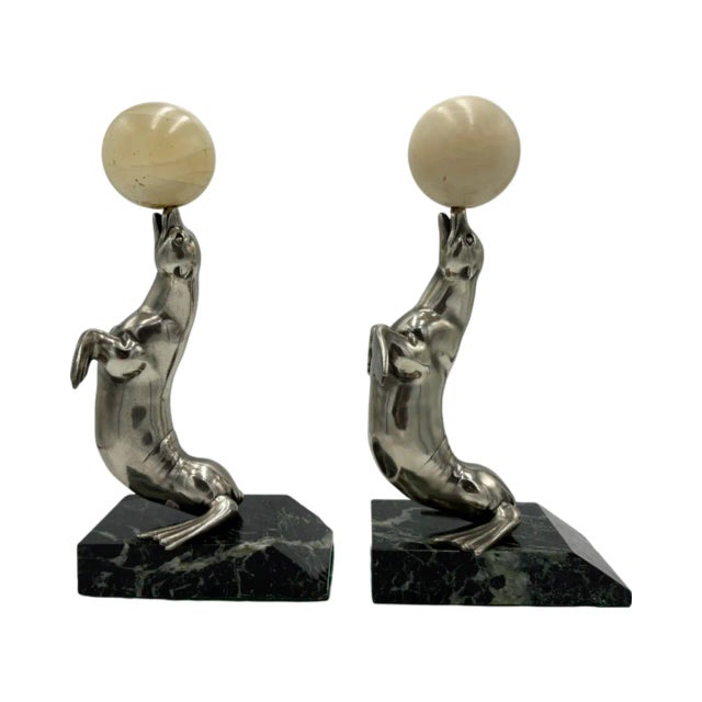 Details: -Bookends are in the shape of a seal lion sitting on marble base -Seals are silverplate over bronze -Each seal is...