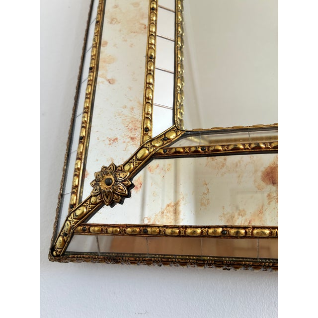 A large vintage Spanish Venetian-style rectangular beveled wall mirror, dating to the 1980s. The mirror has a decorative...