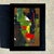 This small abstract painting features soft, layered strokes of green, black, red, and brown, with subtle hints of warm...