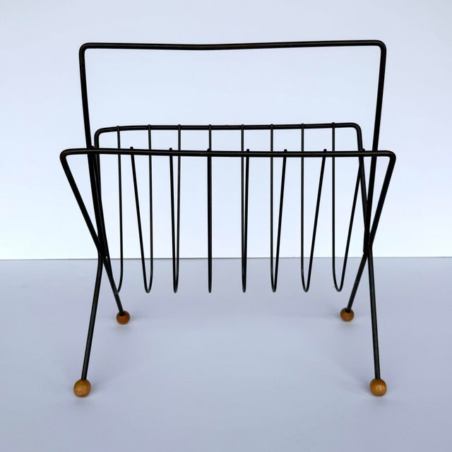 An iconic magazine rack in great vintage condition! Lends your home a classic air of mid century modernism while keeping...