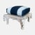 blue and white cushion ottomans with elephant carvings.