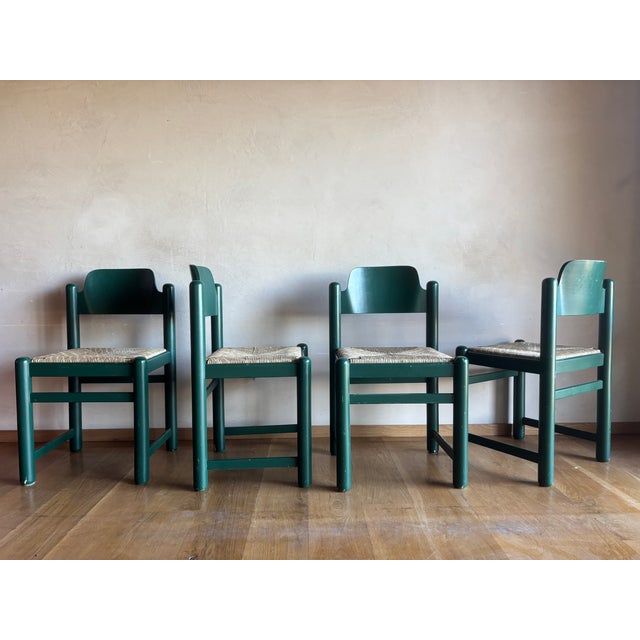 Unusual Hank Lowenstein green Padova chairs with striated woven rush seats, set of four, unsigned. Wide set, grounded and...